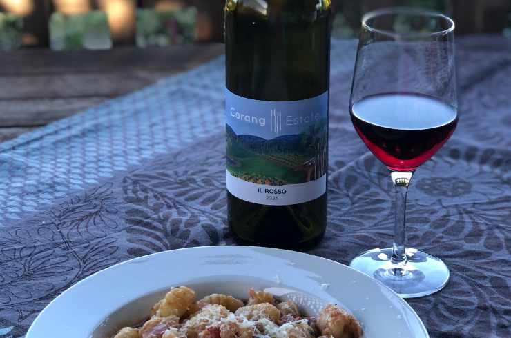 Wine bottle, wine glass and plate of pasta from Corang Estate 